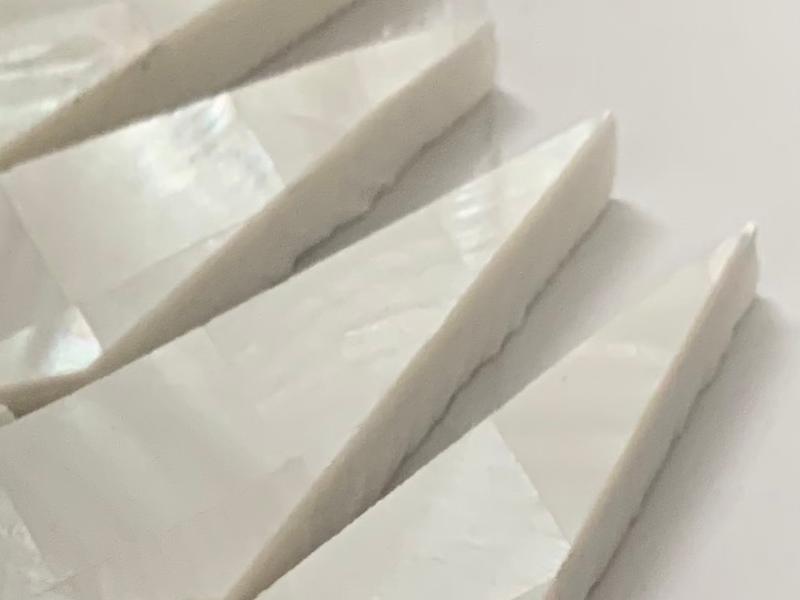 https://www.wanpomosaic.com/lantern-shape-thassos-marble-and-white-mother-of-pearl-mosaic-tile-product/